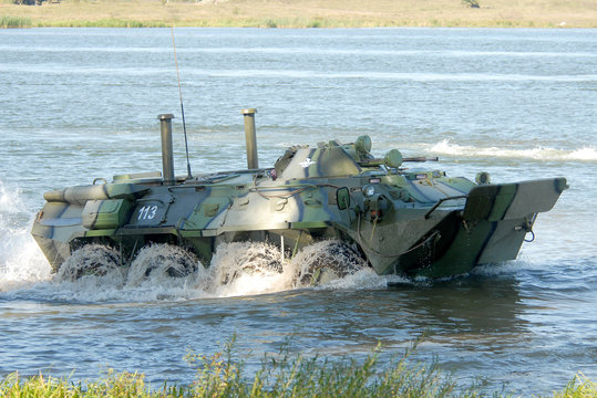 Russian APC BTR-80 crossing the river on maneuvers.