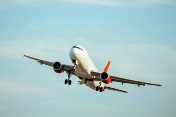 A Commercial air plane taking off.