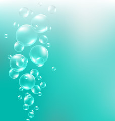 Transparent air bubbles in water on cyan background