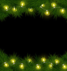 Yellow led Christmas lights on pine branches isolated on black b
