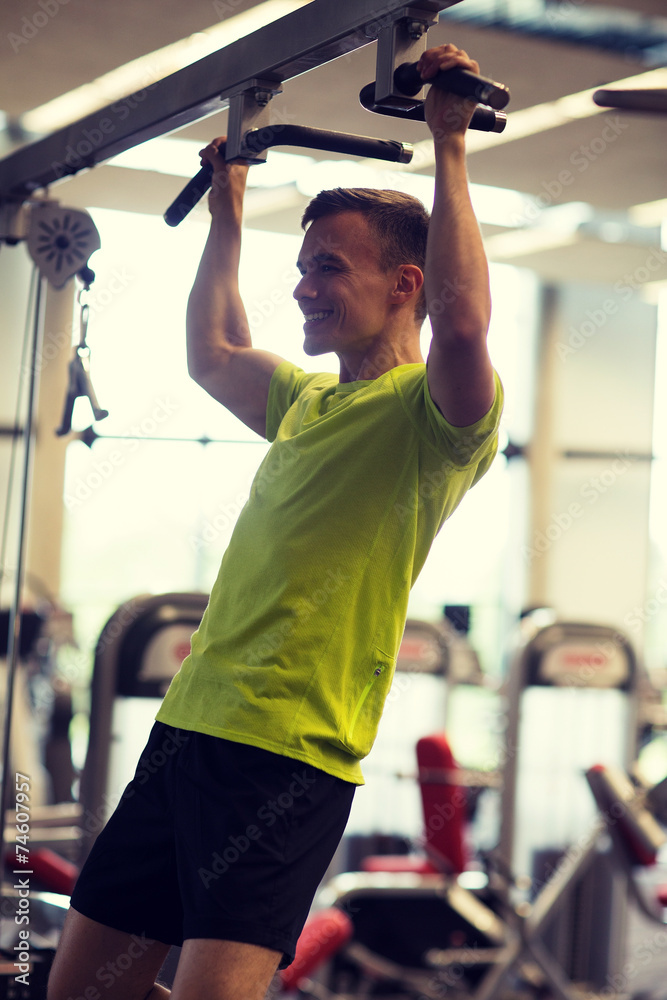 Sticker smiling man exercising in gym