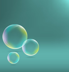 Three transparent soap bubbles with shadows on cyan background