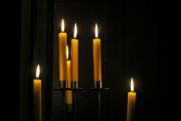 Candles burning in a  room