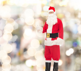 man in costume of santa claus showing thumbs up