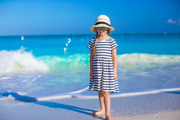 Adorable little girl during beach vacation have fun