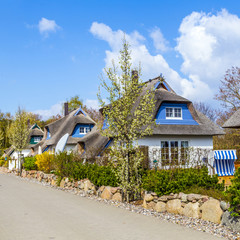 typical village house with reed roof in Usedom - obrazy, fototapety, plakaty