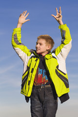 The boy against the blue sky