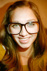 Portrait of Young Woman with Large Glasses