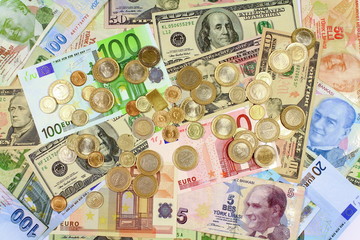 Background from dollars and euro bills. Coins on paper bills