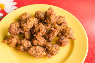 Fried chicken on a yellow plate
