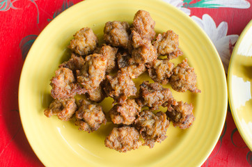 Fried chicken on a yellow plate