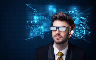 Young man looking with futuristic smart high tech glasses