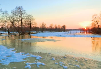 Fototapeten Beginning of spring flood of the river © andrew