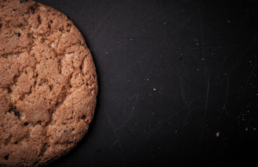 oatmeal cookies on a dark background with place for text