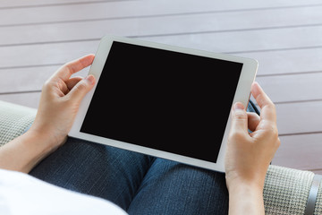 Woman hand hold white tablet with blank empty screen