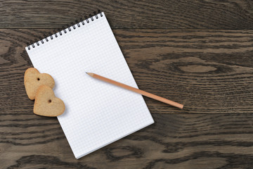 open notebook with heart cookies