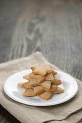 homemade  star shape ginger cookies on wood table