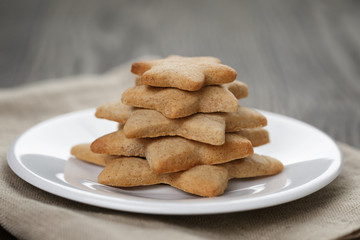homemade  star shape ginger cookies on wood table