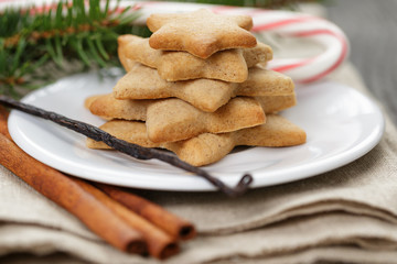 star cookies and candy cane on table