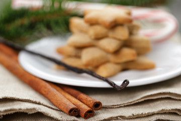 star cookies and candy cane on table
