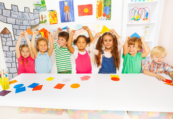 Happy boys and girls in the kindergarten art class