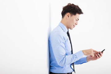 businessman touching smart phone in office