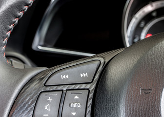modern car audio control on steering wheel