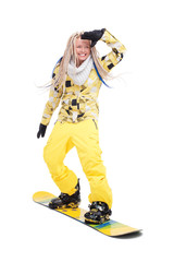 Woman with dreadlocks standing on snowboard