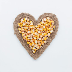 Frame in the shape of heart with corn
