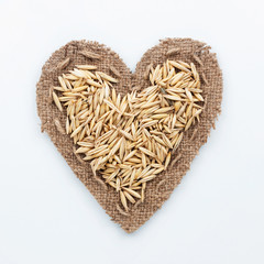 Frame in the shape of heart with  oats