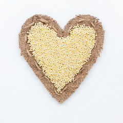 Frame in the shape of heart with millet