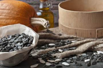 Sunflower and pumpkin seeds on the wooden table