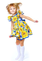Charming girl in a bright dress.