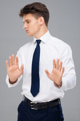 Young man making stop gesture