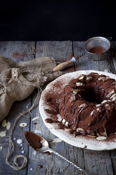 chocolate ring-shaped cake covered with chocolate and almonds