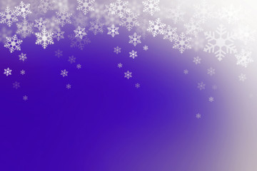 Snow flakes on blue and white, abstract winter background.