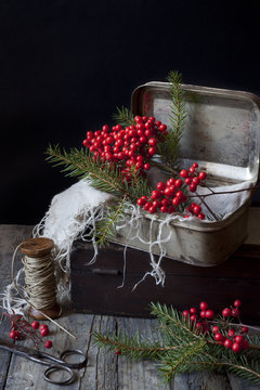 vintage boxes for Christmas gifts with berries and pine twigs