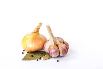 onions and garlic on a bay leaf