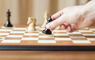 moving chess pieces on chessboard