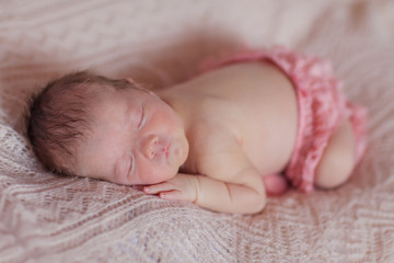 Caucasian newborn baby while sleeping closeup