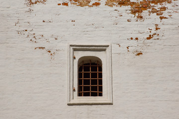 Fototapeta premium window with iron bars on brick wall