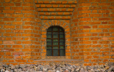 Old brick wall with window closeup