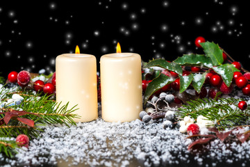 Christmas card of decorated evergreen branches, red leaves, berr