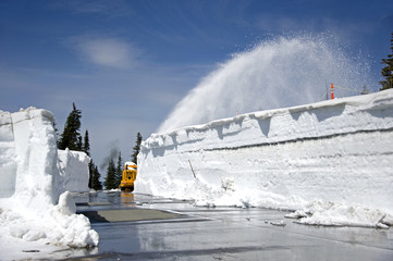 Cleaning snow off the road in May. Hurricane Ridge,