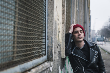 Punk guy posing in the city streets