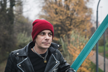 Punk guy posing in the city streets