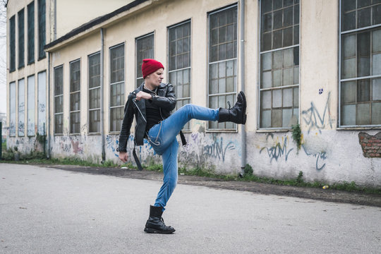 Punk guy posing in the city streets