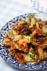 Ruddy chicken wings on a plate