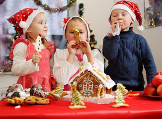 Three kids in caps decorated