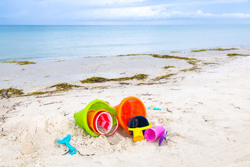Plastic children toys on the sand beach